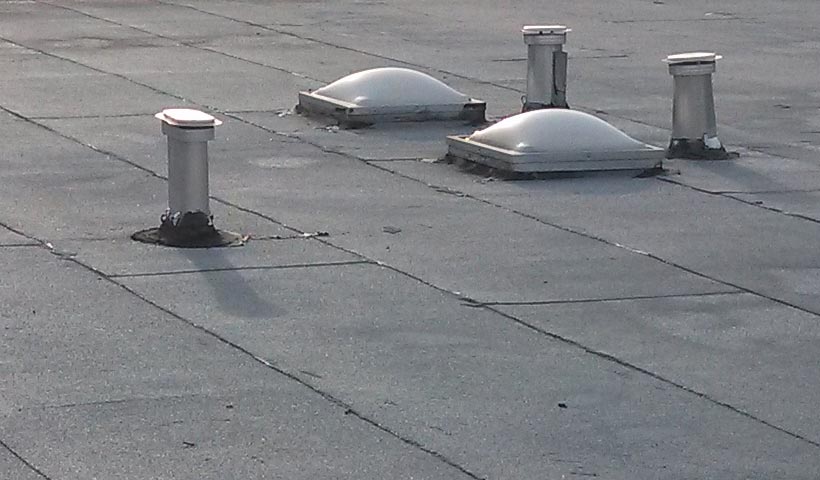 Exhaust vents on a flat roof. 